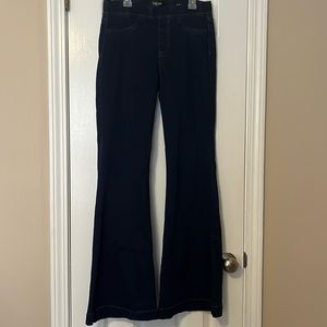 Wide left flare dark wash jeans. Size medium.
